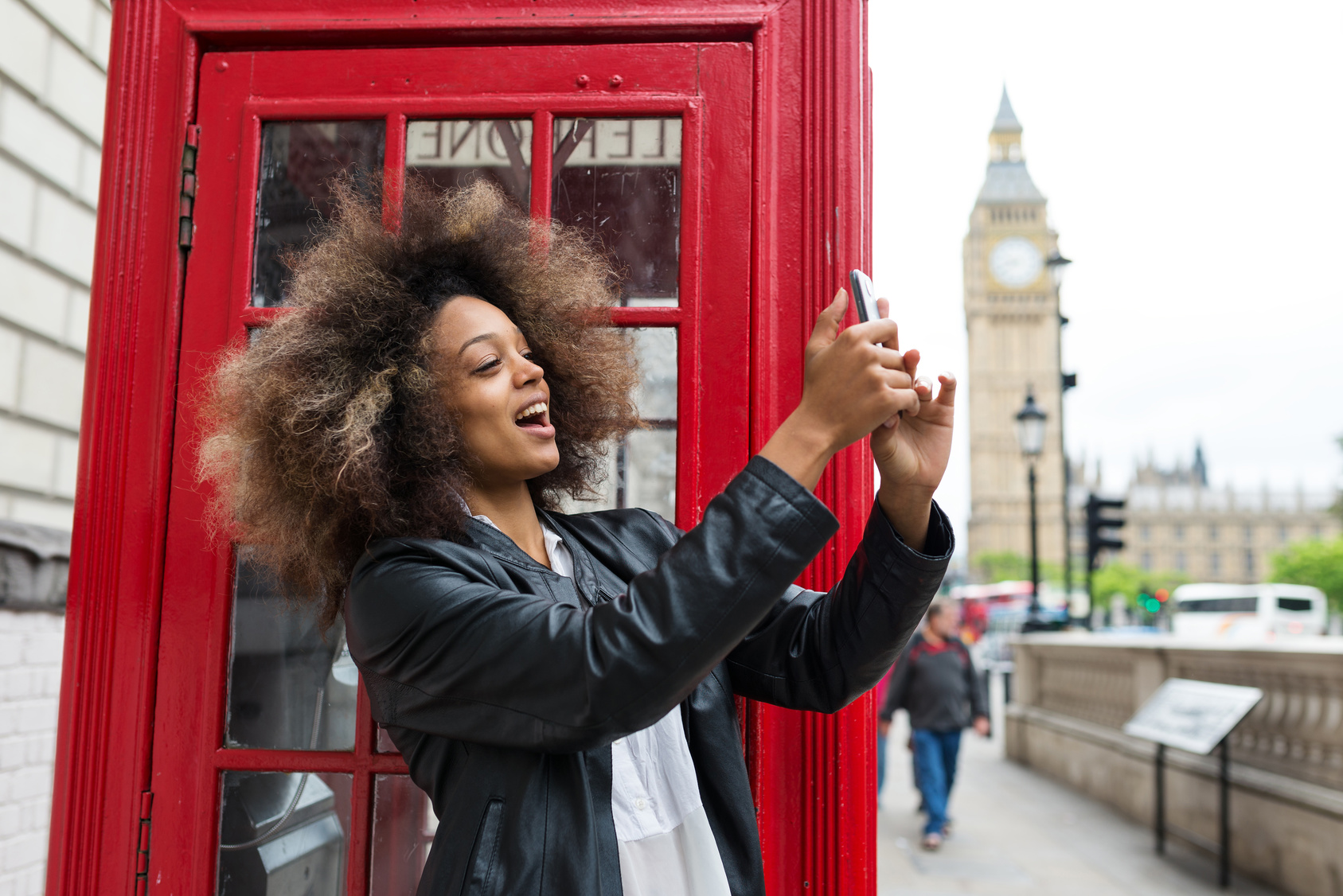 Woman taking selfies in London