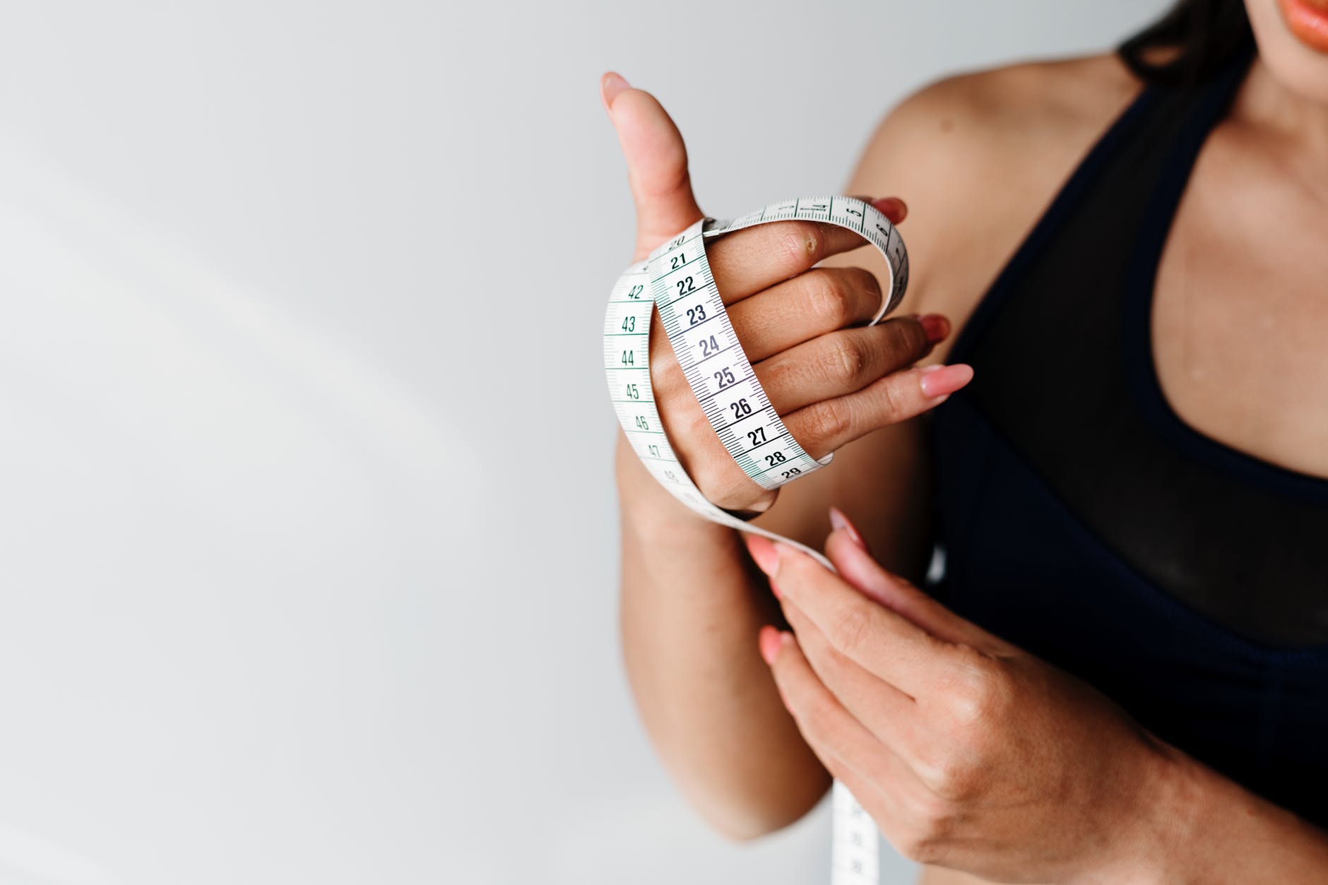 Woman holding a tape measure