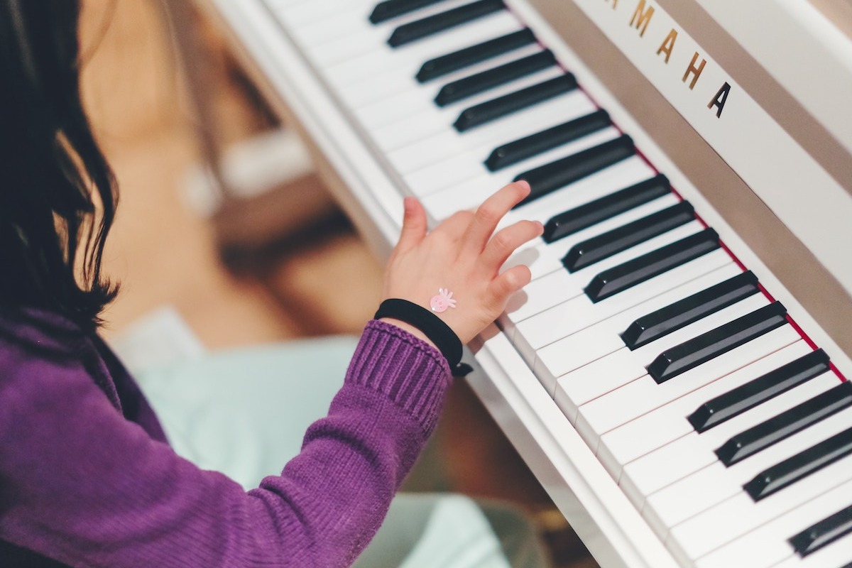 Young girl playing piano