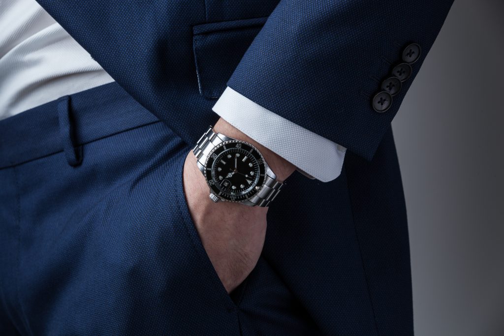 Gentleman in a blue suit wearing a Rolex Gentleman in a blue suit wearing a Rolex